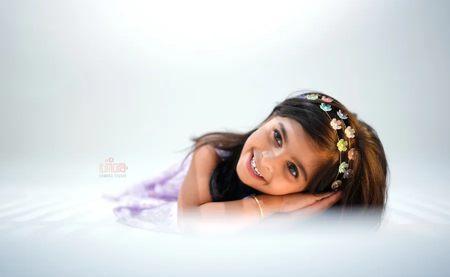 Every smile tells a beautiful story! Capture your little one's precious moments with professional kids photography at Lumora Studio. ❤️