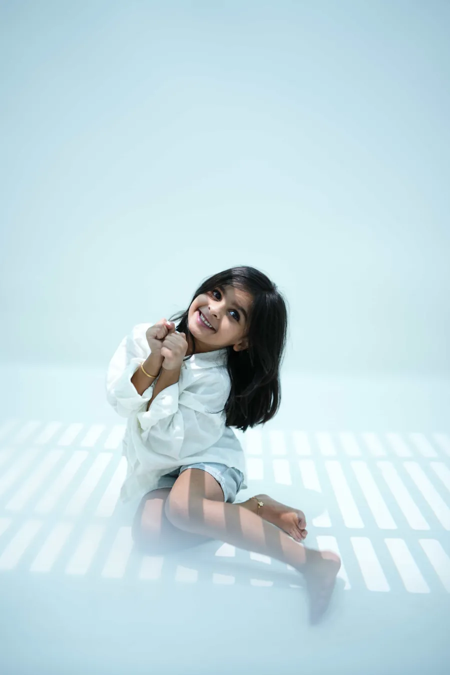 Every smile tells a beautiful story! Capture your little one's precious moments with professional kids photography at Lumora Studio. ❤️